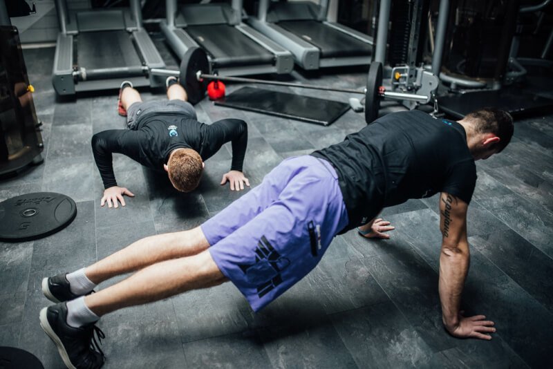 Two men exercising at the gym